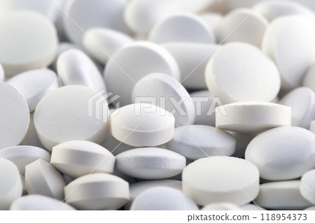 Heap of medicine white pills macro shot Heap of medicine white pills macro shot 118954373