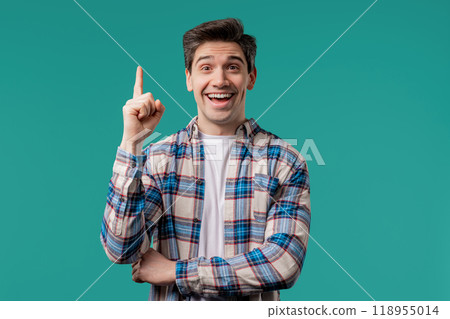 Brainy man having idea eureka moment, pointing finger up on blue. Solution. Brainy man having idea eureka moment, pointing finger up on blue. Solution. 118955014