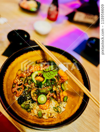 Traditional japanese food in a bowl on a wooden table. Traditional japanese food in a bowl on a wooden table. 118956609