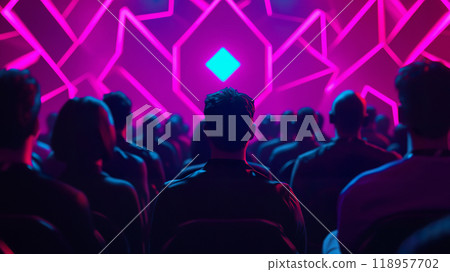 Attendees focus intently on stage during a technology event with vibrant visuals Attendees focus intently on stage during a technology event with vibrant visuals 118957702