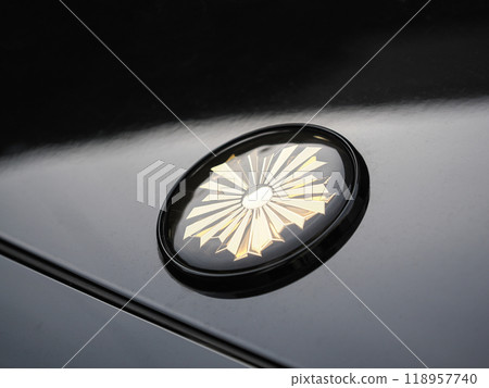 The rising sun emblem on the hood of a police car 118957740