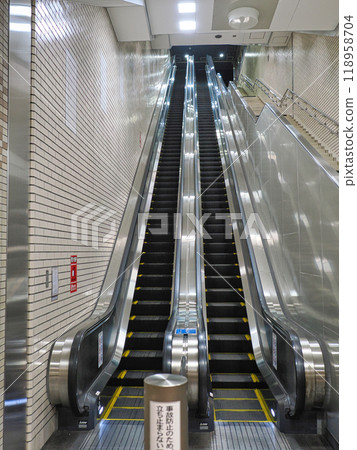 Long escalator in subway station 118958704