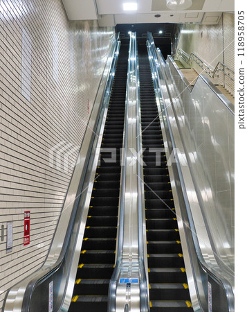 Long escalator in subway station 118958705