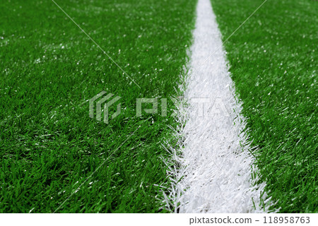 Soccer Football Field Artificial Grass With White Line. Foreground Focus Photo. Soccer Football Field Artificial Grass With White Line. Foreground Focus Photo. 118958763