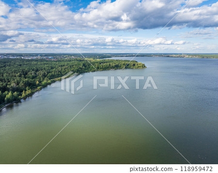 Aerial view of lake or river green shore with forest. Summer season. 118959472