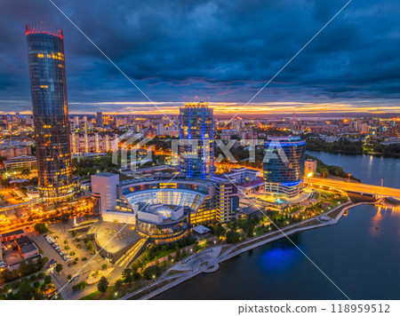 Yekaterinburg city and pond aerial panoramic view at summer or early autumn night. Night city in the early autumn or summer. Yekaterinburg city and pond aerial panoramic view at summer or early autumn night. Night city in the early autumn or summer. 118959512