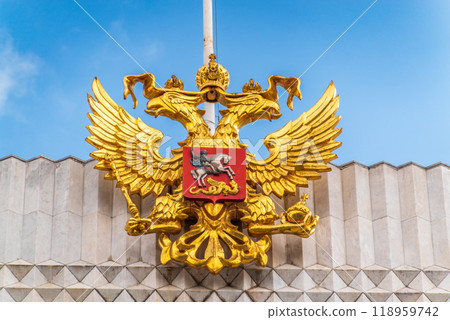 Double golden eagle. Coat of arms of Russia on the roof top of the Big Kremlin concert hall 118959742