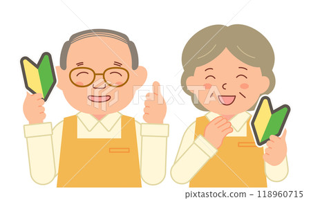 一名資深工作人員手裡拿著初學者的標記，微笑著。 118960715