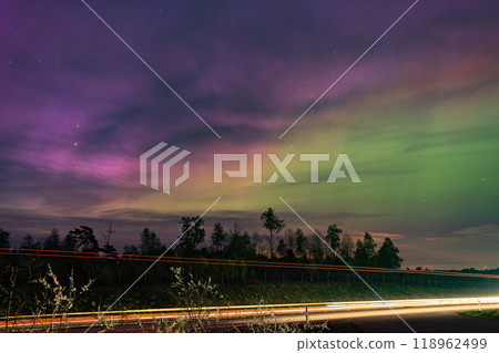 Aurora and light trails dancing in the night sky 118962499