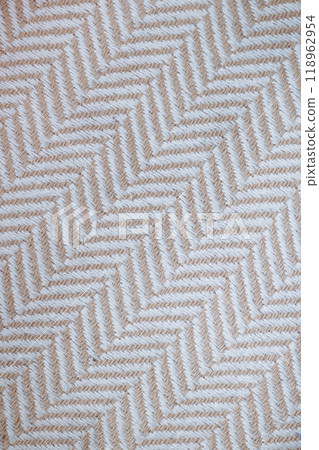 A checkered patterned fabric with white and tan colors A checkered patterned fabric with white and tan colors 118962954