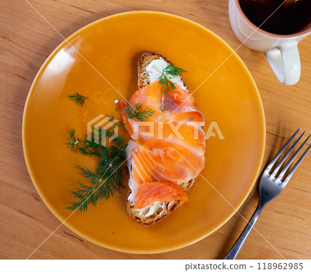 Sandwich with salmon served on platter 118962985