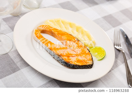 Traditional spanish dish, salmon with mash potatoes served with lemon Traditional spanish dish, salmon with mash potatoes served with lemon 118963288