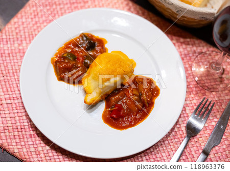 Popular dish of european cuisine is Bacalao 118963376