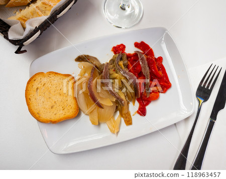 Top view of traditional Catalan escalivada from grilled eggplant, onion and bell pepper served with anchovy fillets Top view of traditional Catalan escalivada from grilled eggplant, onion and bell pepper served with anchovy fillets 118963457