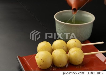 Sweet potato dumplings Pouring tea in a teapot Sweet potato dumplings Pouring tea in a teapot 118964042