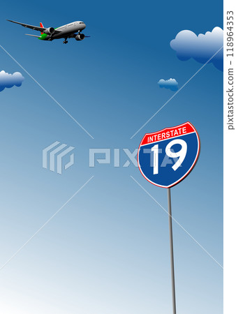 Airplane flying over interstate 19 road sign with blue sky 118964353