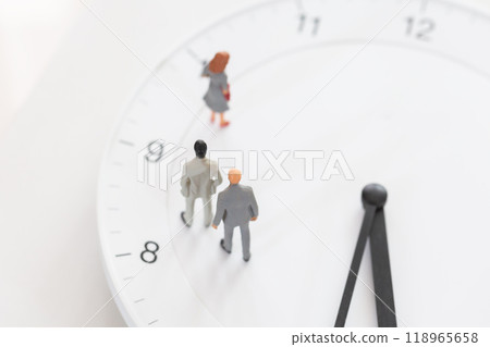 Clock face and male doll in business suit - image of working hours and career Clock face and male doll in business suit - image of working hours and career 118965658