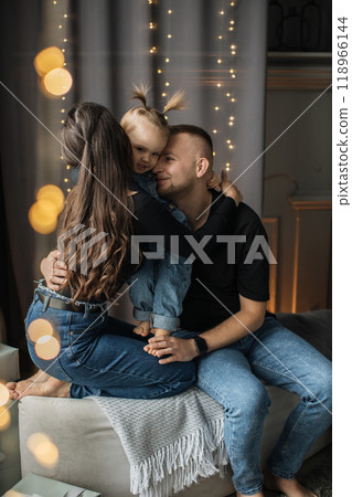 Happy family moment with parents and child at home Happy family moment with parents and child at home 118966144