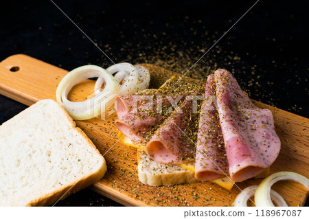 Slices of sausage Mortadella and onion on cutting board Slices of sausage Mortadella and onion on cutting board 118967087