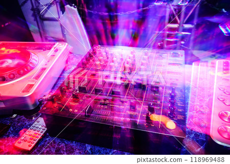 music dj panel mixer in a booth at a nightclub 118969488