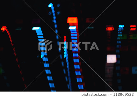 colored traces from effects on long exposure from light buttons musical equipment on dark background colored traces from effects on long exposure from light buttons musical equipment on dark background 118969528