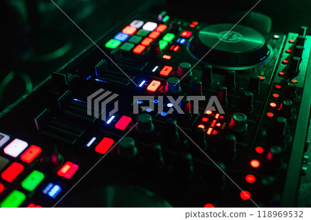 backlit buttons on modern Board of management of music for DJ with different colors backlit buttons on modern Board of management of music for DJ with different colors 118969532