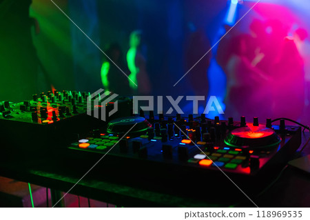 mixer Board for professional DJ disks under colored lights 118969535