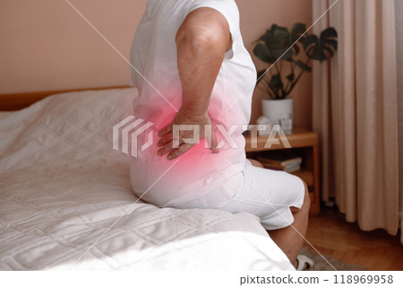 Mature senior lady feeling muscles pain attack, holding back, having problem with standing up. Elderly woman suffering from chronic backache, kidney disease, lumbar osteochondrosis, inflammation 118969958