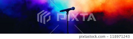 Microphone standing on an empty stage with colorful light and smoke. Mic on a stage 118971243