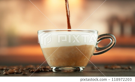 Pouring Coffee into Frothed Milk. 118972203
