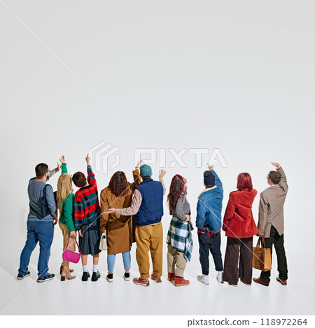 Group of people, men and women wearing stylish autumn outfits, showing their readiness and excitement to get best shopping deals Group of people, men and women wearing stylish autumn outfits, showing their readiness and excitement to get best shopping deals 118972264