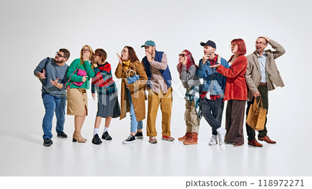 Group of people, men and women wearing stylish autumn outfits, waiting for seasonal sales., whispering about best deals in stores Group of people, men and women wearing stylish autumn outfits, waiting for seasonal sales., whispering about best deals in stores 118972271