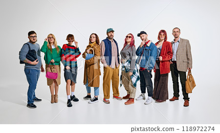 Group of people, men and women wearing stylish autumn outfits, waiting for seasonal sales. Ready to grab the best discounts 118972274