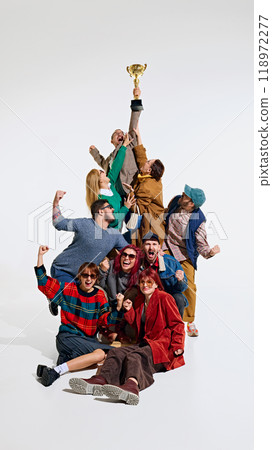 Crowd of people forming a human tower, showing their excitement to get the best shopping deals. Champion gets the best price 118972277