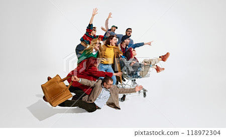 Group of people men and women rushing forward with outstretched hands, falling down, trying to get the best discounts 118972304