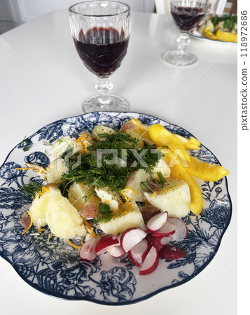 European cuisine, potatoes with dill salad and radishes. glass of wine 118972686