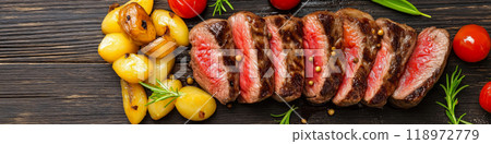 Steaks. Delicious steak served with pasta and potatoes 118972779