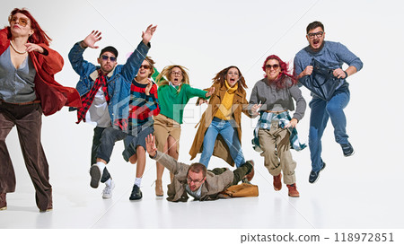 Shopping madness. Emotional people in stylish autumn outfits rushing forward with passion and urgency to get best shopping deals. Shopping madness. Emotional people in stylish autumn outfits rushing forward with passion and urgency to get best shopping deals. 118972851