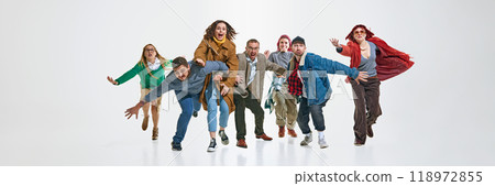 Group of emotional people, in stylish clothes running with excitement for Black Friday sales, trying to get the best discounts. Group of emotional people, in stylish clothes running with excitement for Black Friday sales, trying to get the best discounts. 118972855