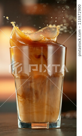 Macro Shot of Splashing Ice Coffee in a cafe, Close-up 118972900