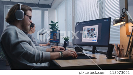 Adult man in headphones enters prompt in AI image generator on computer Adult man in headphones enters prompt in AI image generator on computer 118973061