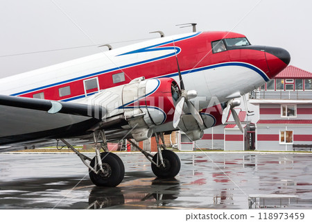 Retro airplane on the rainy day at the airport 118973459