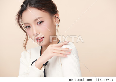 Beautiful young asian woman with clean fresh skin on beige background, Face care, Facial treatment, Cosmetology, beauty and spa, Asian women portrait. 118973605