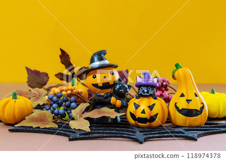 Halloween background 3: Spider web, pumpkin, black cat and fallen leaves Halloween background 3: Spider web, pumpkin, black cat and fallen leaves 118974378