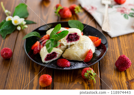 cooked sweet homemade steamed dumplings with strawberries 118974443