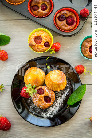Sweet curd muffins with strawberry filling 118974444