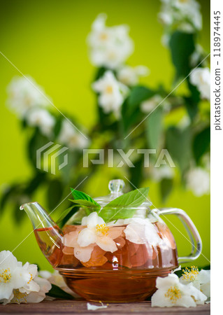 jasmine flower tea in a glass teapot 118974445