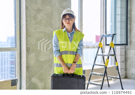 Portrait of female industrial worker builder engineer supervisor at construction 118974491