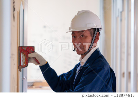 Carpenters and craftsmen working on site 118974613