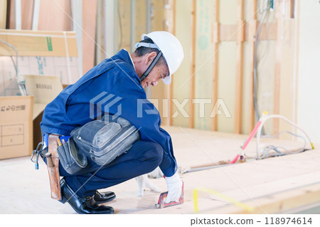 Carpenters and craftsmen working on site 118974614
